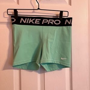 Teal Nike pro shorts.